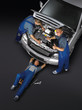 Motor mechanics are working around the car