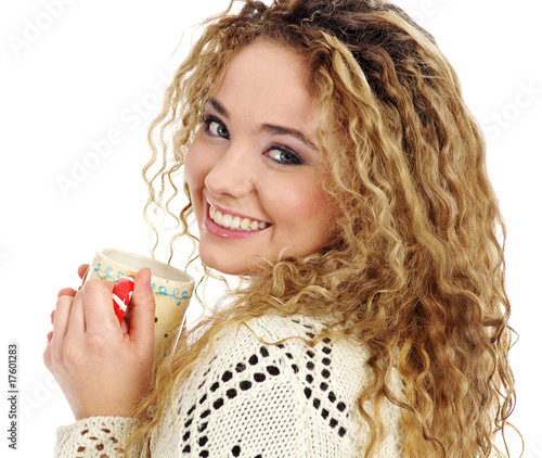 Photo: Young attractive blond woman drinking tea Young attractive blond woman drinking tea