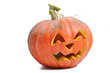 The carved face of pumpkin glowing on Halloween