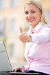 Photo: Businesswoman with thumbs up Businesswoman with thumbs up