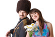 Youth man in military and girlfriend with flowers.