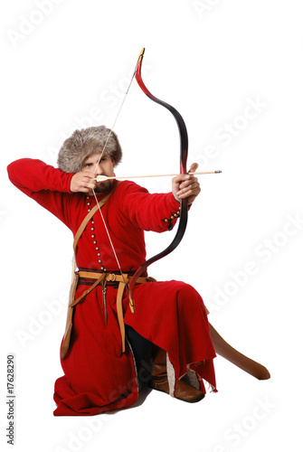 Photo: Tatar warrior with a bow in kneeling position. Tatar warrior with a bow in kneeling position.