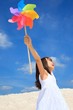 Photographie : Girl with pinwheel on beach