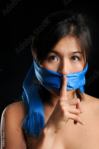 Photo: Girl gagged with blue scarf Girl gagged with blue scarf