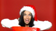 Sexy girl in santa claus hat with shopping bag