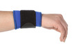 Human hand with a wrist brace, orthopeadic equipment