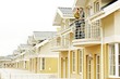 couple on balcony of one-family house