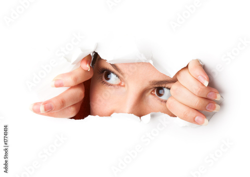 Photo: Eye looking through hole Eye looking through hole