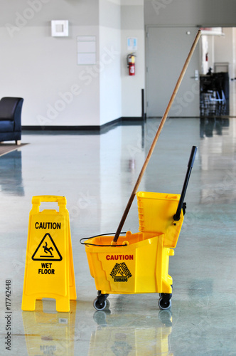 Photo: Mop and Bucket with Caution Sign Mop and Bucket with Caution Sign