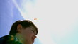 Video: Boy playing with kite over blue sky Boy playing with kite over blue sky