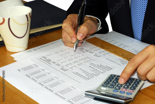 Checking the company financial statement by the accountant Checking the company financial statement by the accountant