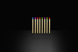 matches with colored heads on a black background