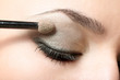 closeup eye of woman applying makeup