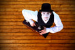 Portrait of the mime in a make-up on wood background