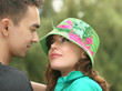 A portrait of a sweet couple in love. Nature background A portrait of a sweet couple in love. Nature background