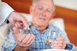 Patient being given life saving pills by a doctor