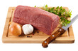 Raw beef on cutting board isolated on white background