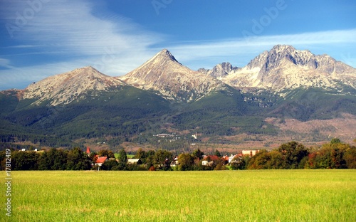 Photo: A view of The Tatra Mountains and village in summer, Slovakia. A view of The Tatra Mountains and village in summer, Slovakia.