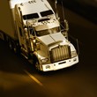 speed yellow semi-truck on highway