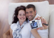 Couple playing with digital camera Couple playing with digital camera