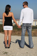 Lovers couple holding hands outdoor. Lovers couple holding hands outdoor.