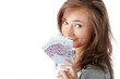woman holding euros bills and house model