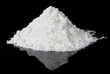 White powder on black reflective surface White powder on black reflective surface