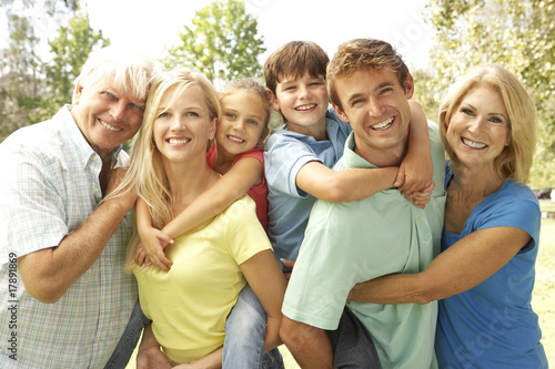 Photo: Mother And Father Giving Children Piggy Back With Grandparents Mother And Father Giving Children Piggy Back With Grandparents