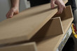 Carpenter Assembling Cabinet  In Workshopp