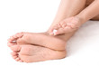 Applying cream to feet