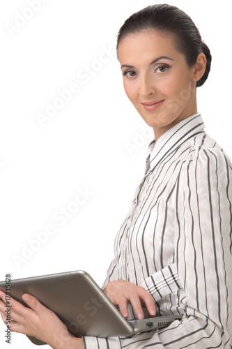 Photo: The beautiful woman holding the laptop The beautiful woman holding the laptop