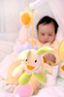Photo: cute baby girl laying in white bed cute baby girl laying in white bed