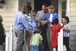 Two families greeting each other on porch