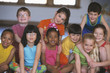 Group of children smiling indoors