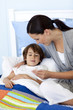 Mother taking her son's temperature