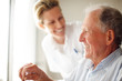 Happy elderly man , young nurse at the back