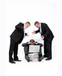Mobbing - men shout at man working on notebook Mobbing - men shout at man working on notebook