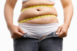 fat woman holding her unzip jeans