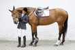 Hispanic female equestrian and horse