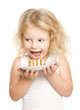 Little girl wants to bite off a piece of cake - isolated