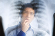 Asian doctor examining xray negative