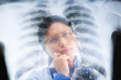 Asian female doctor busy working on x-ray result