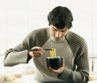 Young man eating noodles