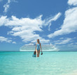 Pacific Islander woman with snorkeling gear in front of cruise ship