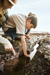 Ranger and children looking at tide pool