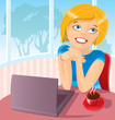 The young woman works behind the laptop with a coffee cup