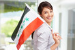 Lovely young woman with an Iraqi flag