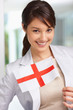 Lovely young female with an English flag , smiling
