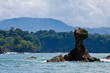 Rock island in the sea with trees and blue sky Rock island in the sea with trees and blue sky