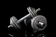 set of dumbells on black